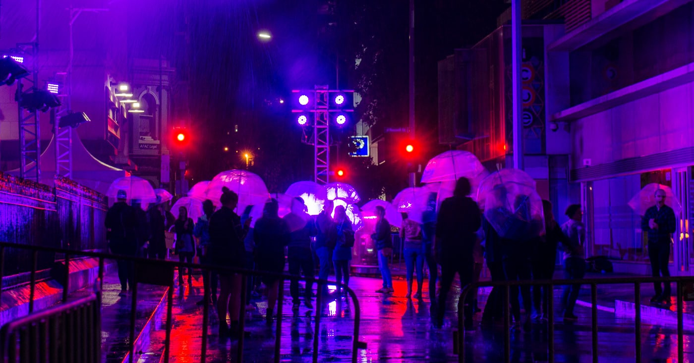 Standing in the rain installation at White Night, Melbourne