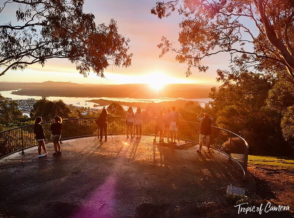 People watch the sunset at Laguna Lookout in Noosa National Park